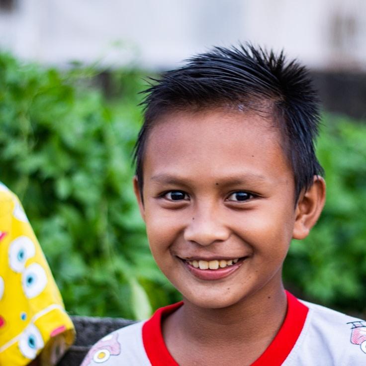 Alex Kim, Lead Design Curator at BeaconLanternHarbor, reviewing corporate floral arrangements